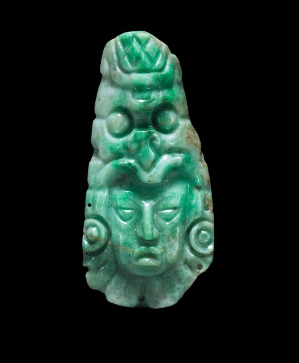 Mayan chalchihuitl head ornament from the Copan archaeological site in western Honduras (ca. 600–900 ce). Carving and photo: Cleveland Museum of Art; size: 7.7 × 3.8 cm.