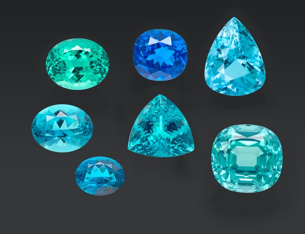 A selection of copper-bearing tourmalines from Brazil, Mozambique and Nigeria, and two additional samples (two oval stones on the bottom left of the image) analysed recently at SSEF, which based on preliminary data possibly originate from the newly reported source in Ethiopia.